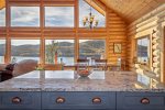 Prepare a meal in the kitchen while enjoying amazing views of Whitefish Lake.